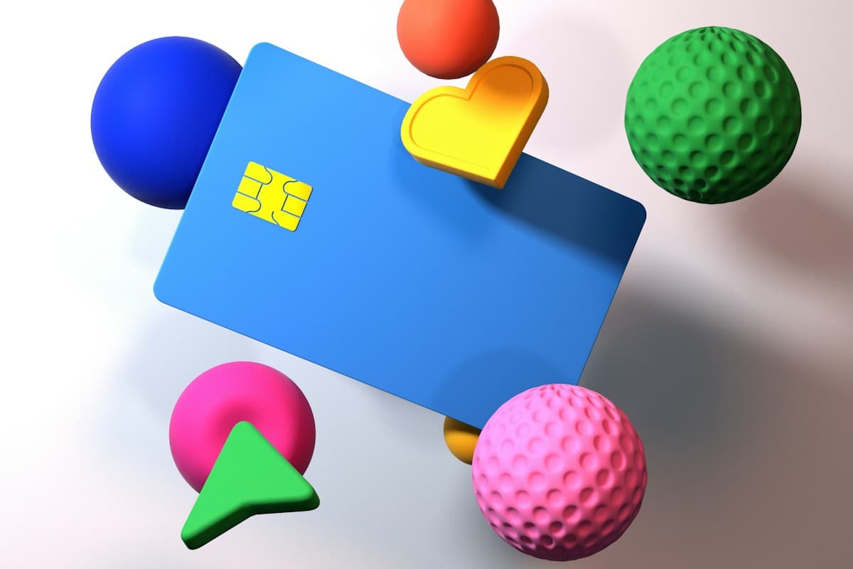 A blue card surrounded by playful geometric shapes; illustrative editorial photography