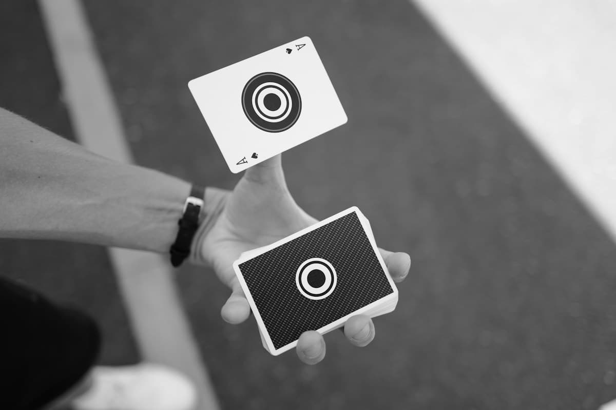 A creative holding a camera in a dramatic landscape; illustrative editorial photography
